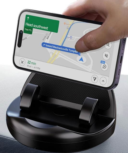 Adjustable dashboard car phone holder holding a smartphone for navigation